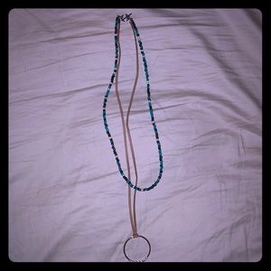 Necklace with pendant and seed beads.